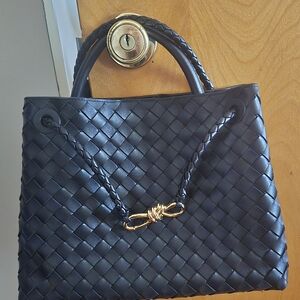 Chic Black Woven Tote Bag with Gold Accent
